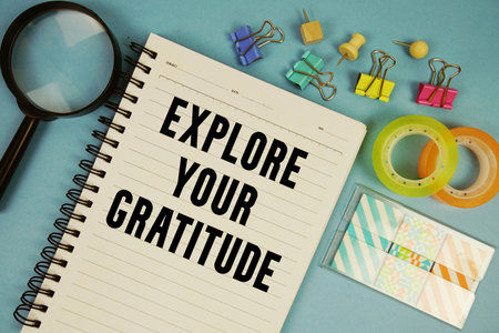 Explore Your Gratitude text with magnifying glass on blue backgroundの写真素材