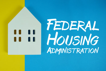 FHA Federal Housing Administration text with house models on blue backgroundの写真素材