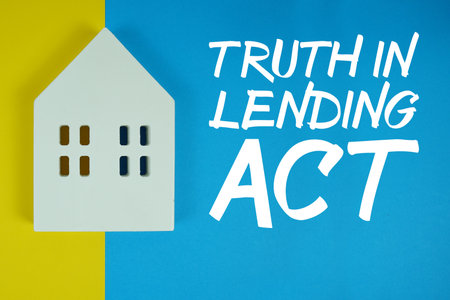 TILA Truth in Lending Act text with house models on blue backgroundの写真素材