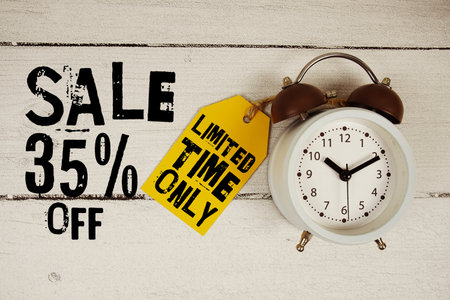 Sale 35% off Limited Time Only text with alarm clock on wooden backgroundの写真素材