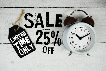 Sale 25% Limited Time Only text with alarm clock on wooden backgroundの写真素材