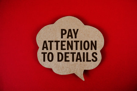 Pay Attention To Details text with speech bubble on red backgroundの写真素材