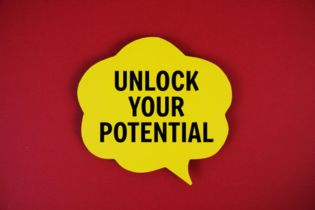 Unlock Your Potential text with speech bubble on red backgroundの写真素材