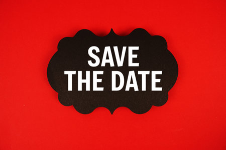 Save The Date text with speech bubble on red backgroundの写真素材