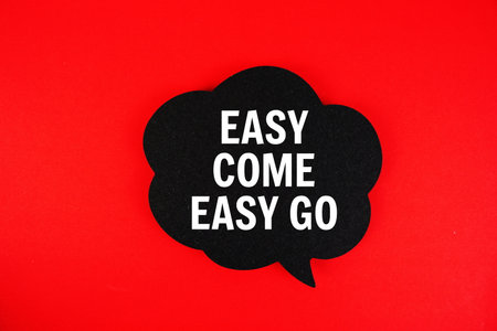 Easy Come  Easy Go text with speech bubble on red backgroundの写真素材