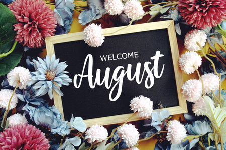 Welcome August text with flowers decoration on yellow background