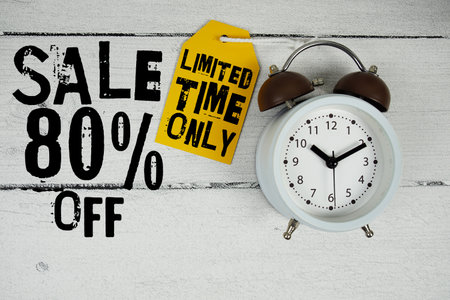 Sale 80% of Limited Time Only text with alarm clock on wooden backgroundの写真素材