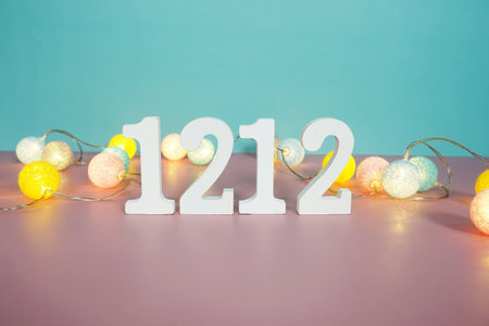 12.12 Sale  Promotion and Marketing with cotton balls decoration on green and pink backgroundの写真素材