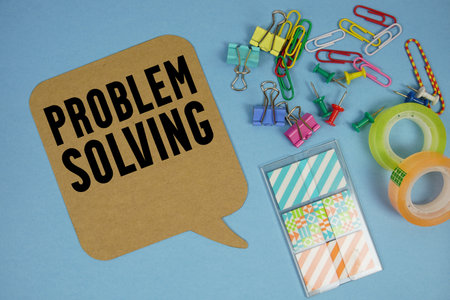Problem Solving text with stationery on blue backgroundの写真素材