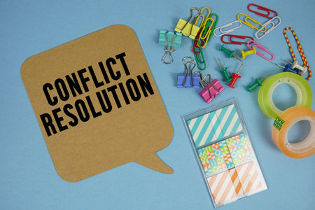Conflict Resolution text with stationery on blue backgroundの写真素材