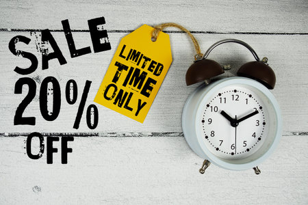 Sale 20% of Limited Time Only text with alarm clock on wooden backgroundの写真素材