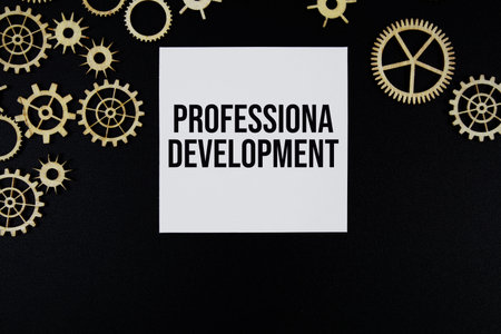 Professional Development text message on sticky note on black background