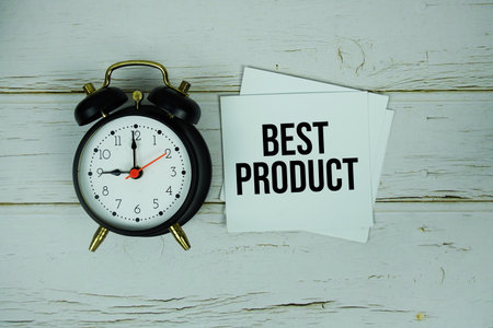 Best Product text message on paper with alarm clock on wooden backgroundの写真素材