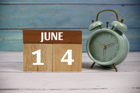Wooden Calendar Showing the Date of June 14th. Day 14 of June Monthの写真素材