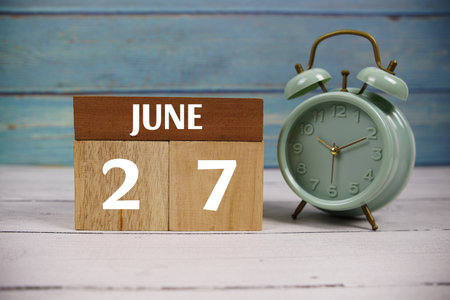 Wooden Calendar Showing the Date of June 27th. Day 27 of June Monthの写真素材