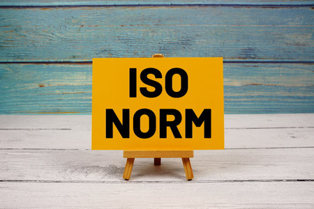 ISO NORM text written on paper card on wooden backgroundの写真素材