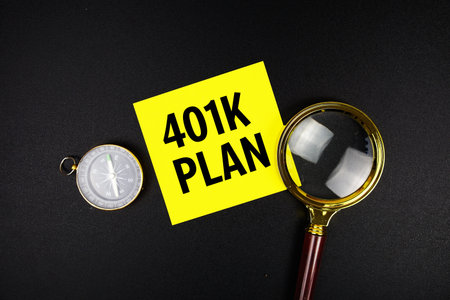 401 Plan text message on sticky note with magnifying glass and compass on black background