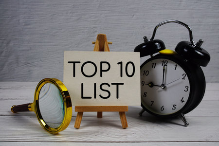 Top 10 List text with alarm clock and magnifying glass on wooden backgroundの写真素材
