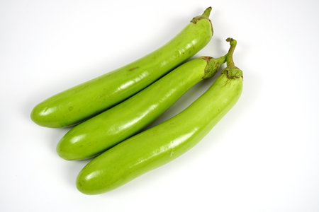 Fresh green long Thai eggplants isolated on white backgroundの写真素材