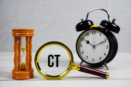 CT Central Time text with alarm clock on wooden backgroundの写真素材