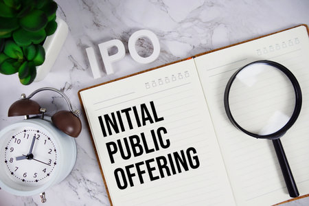 IPO - Initial Public Offering acronym on notepad, Business concept backgroundの写真素材