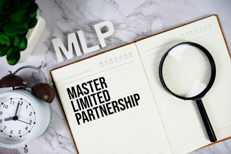MLP - Master Limited Partnership acronym on notepad, Business concept background