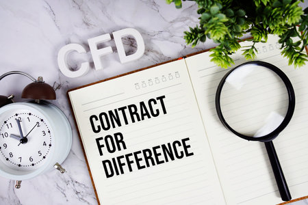 CFD - Contract For Difference acronym on notepad, Business concept background