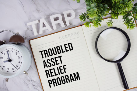 TARP - Troubled Asset Relief Program acronym on notepad, Business concept background