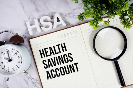 HSA - Health Savings Account acronym on notepad, Healthcare concept backgroundの写真素材