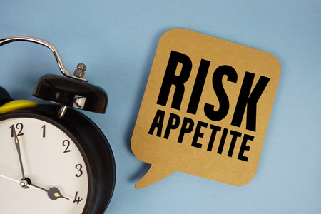 Risk Appetite text with alarm clock on blue background