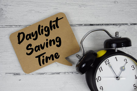 Global Outreach text with alarm clock on wooden backgroundの写真素材