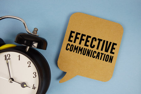 Effective Communication text with alarm clock on blue backgroundの写真素材