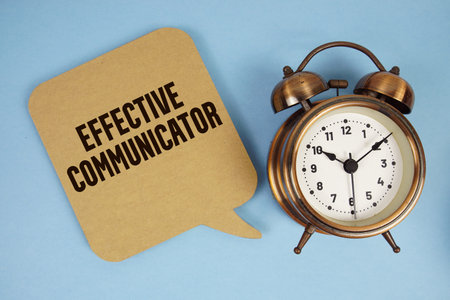 Effective Communicator text with alarm clock on blue background