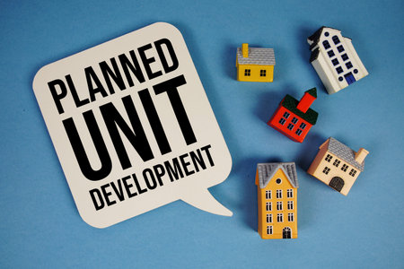 PUD Planned Unit Development text with house models on blue background