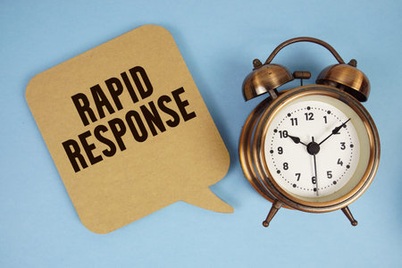 Rapid Response text with alarm clock on blue background