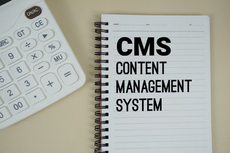 CMS Abbreviations of ontent Management System text with calculator phrase of business and financial conceptの写真素材