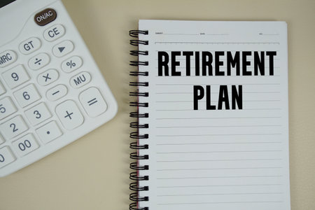 Retirement Plan text with calculator phrase of business and financial conceptの写真素材