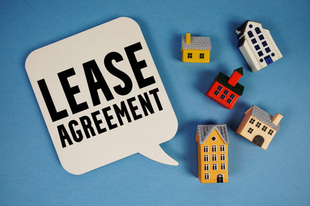 Lease Agreement text with house models on blue background