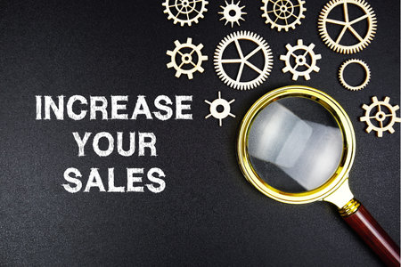 Increase Your Sales text message with magnifying glass on black backgroundの写真素材
