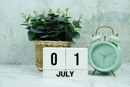 Wooden Calendar Showing the Date of July 1st. Day 1 of July monthの写真素材