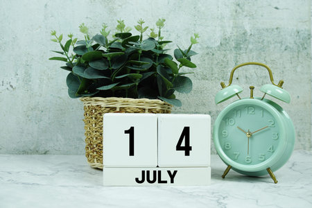 Wooden Calendar Showing the Date of July 14th. Day 14 of July month
