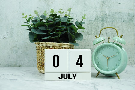 Wooden Calendar Showing the Date of July 4th. Day 4 of July monthの写真素材