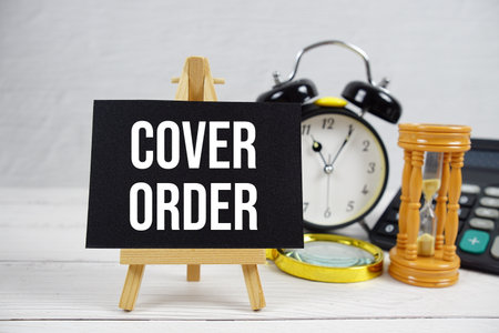 Cover Order text with magnifying glass and calculator on wooden backgroundの写真素材