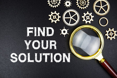 Find Your Solution text message with magnifying glass on black backgroundの写真素材