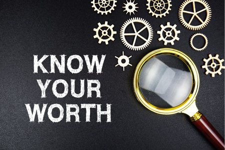 Know Your Worth text message with magnifying glass on black background