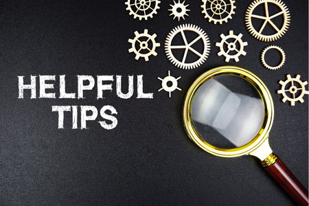 Health Tips text message with magnifying glass on black backgroundの写真素材