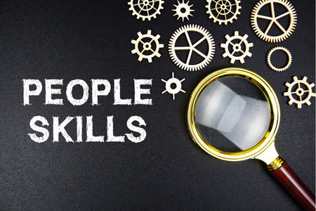 People Skills text message with magnifying glass on black background