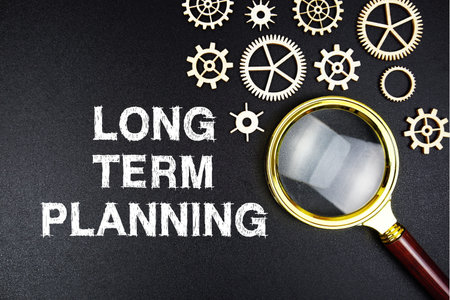 Long Term Planning text message with magnifying glass on black backgroundの写真素材