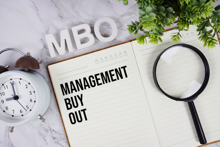 MBO - Management Buyout acronym on notepad, Business concept backgroundの写真素材