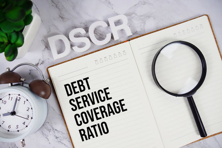 DSCR - Debt Service Coverage Ratio acronym on notepad, Business concept backgroundの写真素材